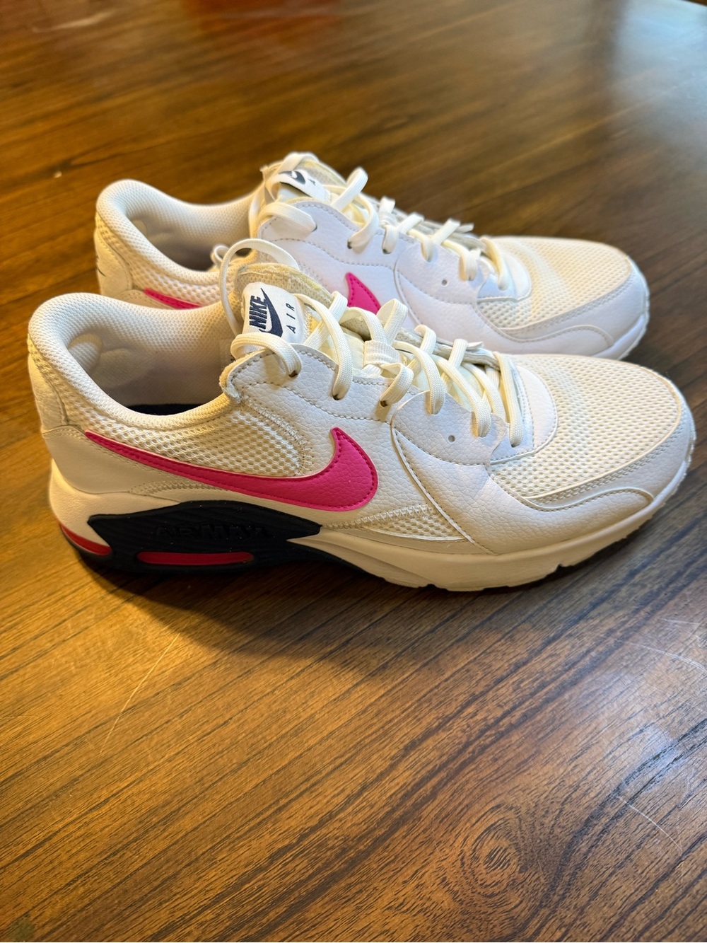 Nike Women's White Sneakers with Pink Swoosh